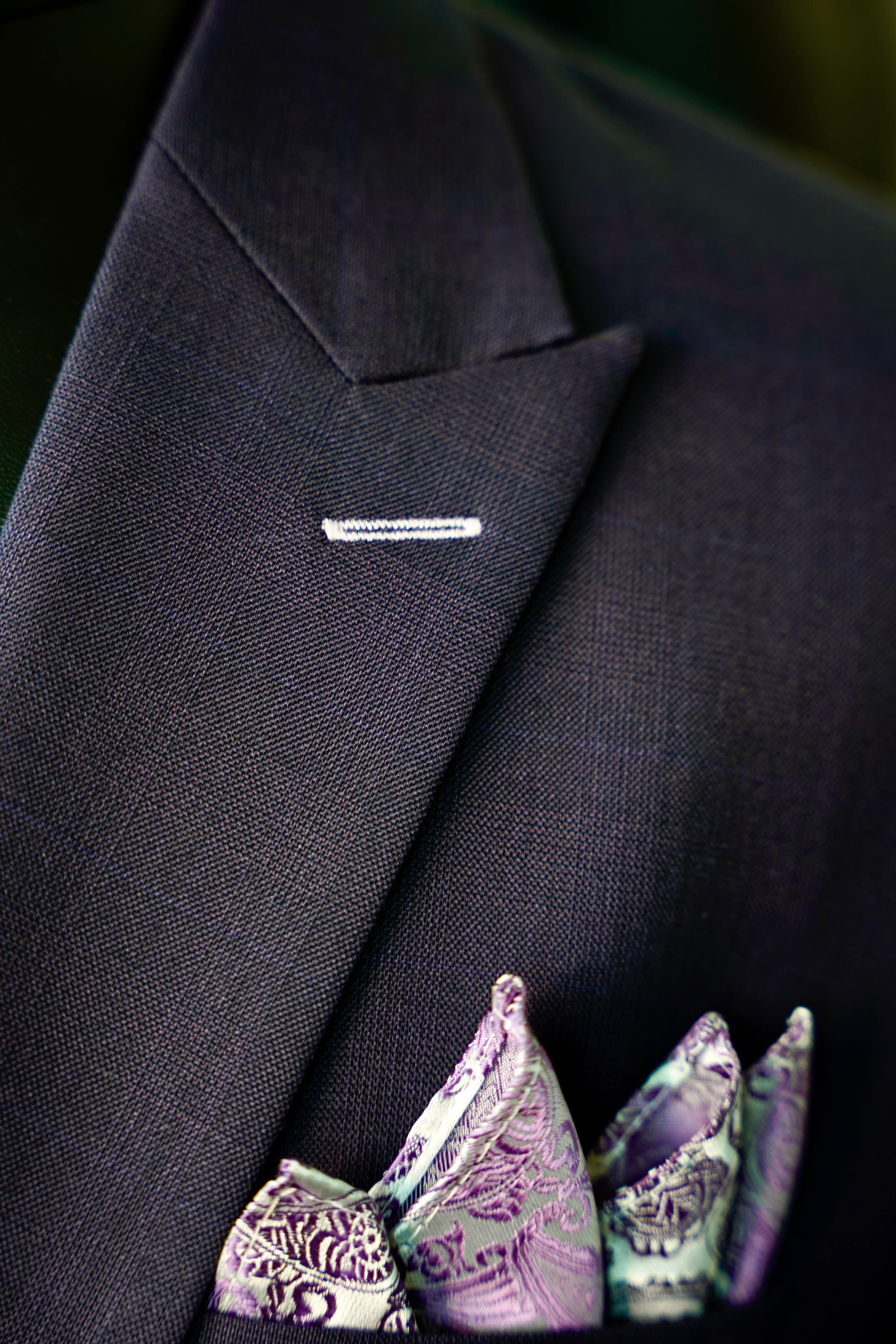 Charcoal lapel with pin and paisley pocket square